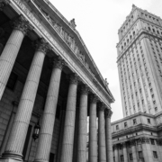 New York, USA - 5 September 2014: Monochrome view looking up at the New York State Supreme Court Building and the US Justice Building, in Lower Manhattan, New York.